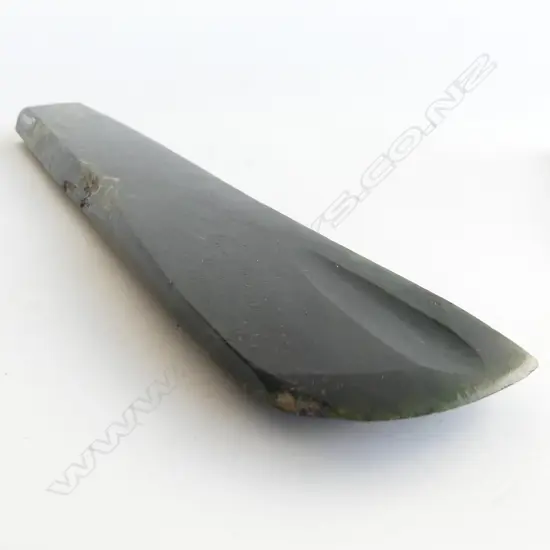 An old Māori long pounamu toki,